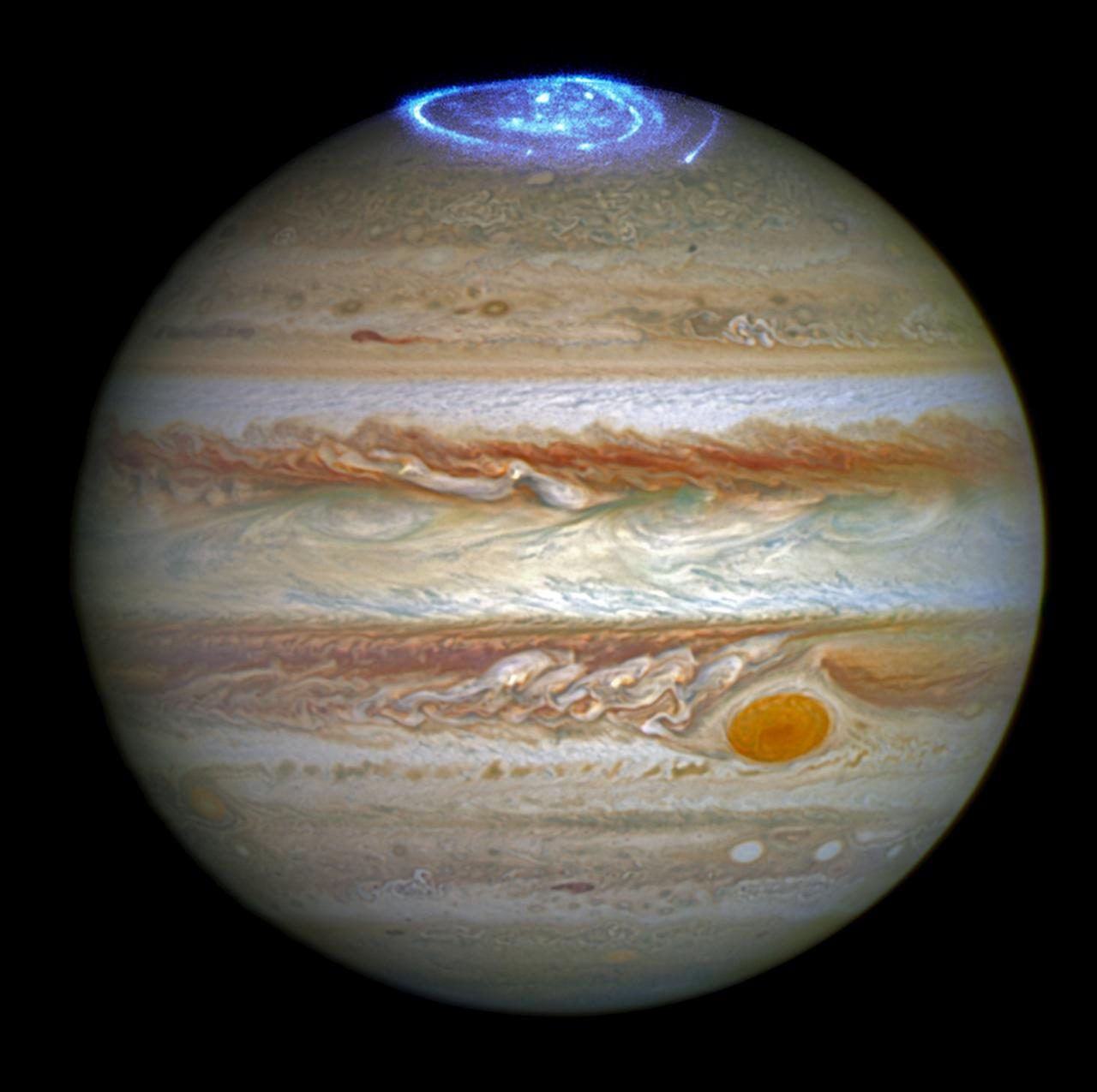 Hubble ultraviolet image of Jupiter’s aurorae, electric rings over the poles larger than Earth.